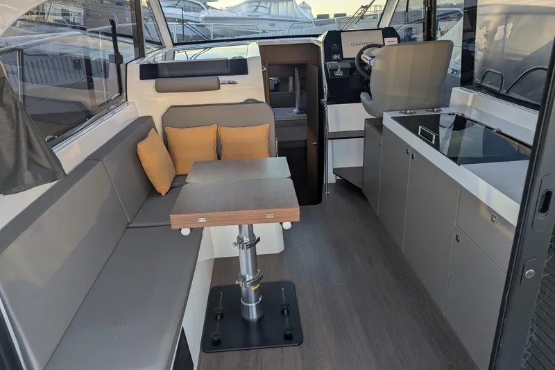 Slide: The Image of 2024 Beneteau Antares 11 interior with sleek cabinetry and modern design elements. - 9