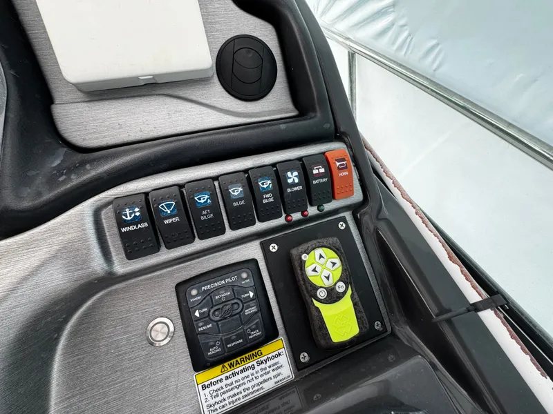 Slide: The Image of 2016 Monterey 335 Sport Yacht control panel with switches. - 10