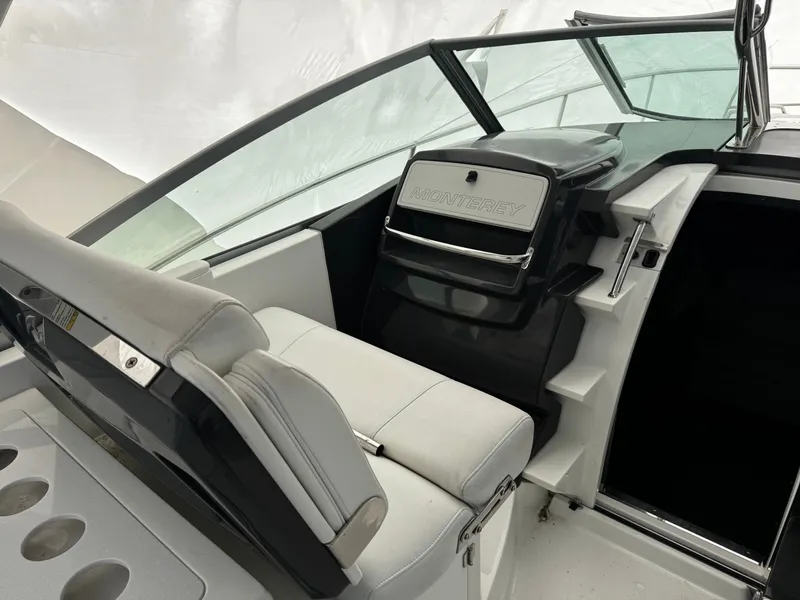 Slide: The Image of Interior of 2016 Monterey 335 Sport Yacht with white seating. - 11
