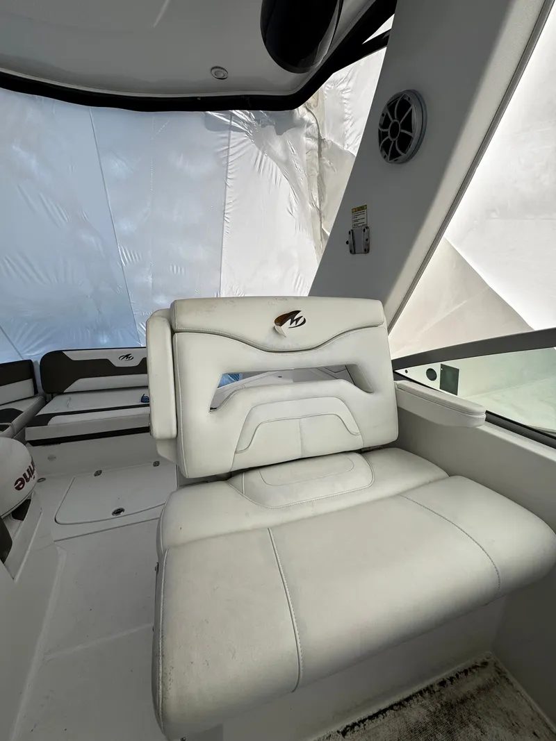 Slide: The Image of Interior of a 2016 Monterey 335 Sport Yacht with white seating. - 12