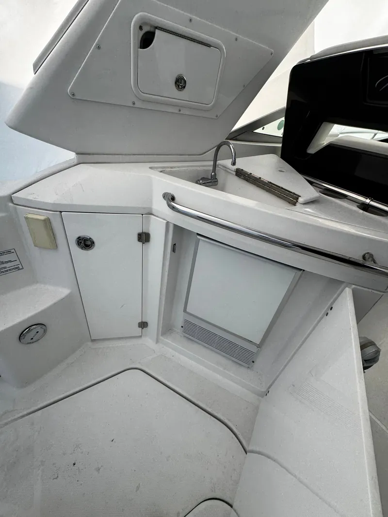 Slide: The Image of Interior of 2016 Monterey 335 Sport Yacht with sink and storage. - 17