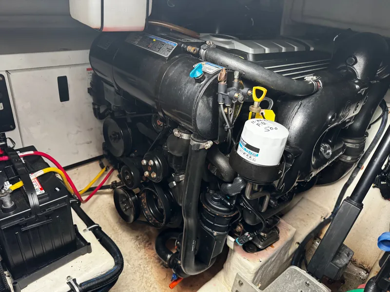 Slide: The Image of Engine compartment of 2016 Monterey 335 Sport Yacht with battery and engine. - 27