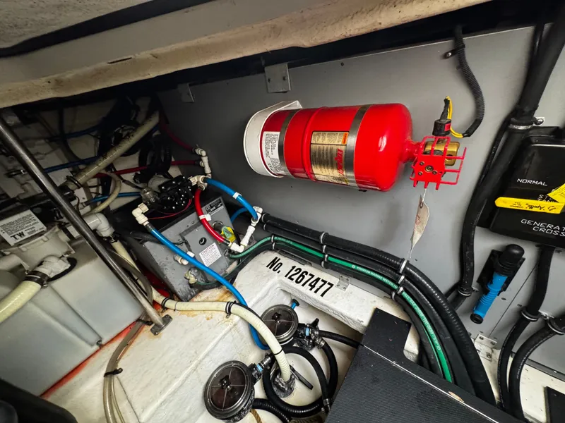 Slide: The Image of Engine room of 2016 Monterey 335 Sport Yacht with fire extinguisher. - 29