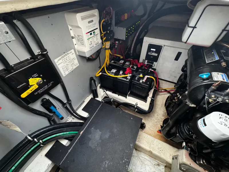 Slide: The Image of Engine room of 2016 Monterey 335 Sport Yacht with batteries and wiring. - 30