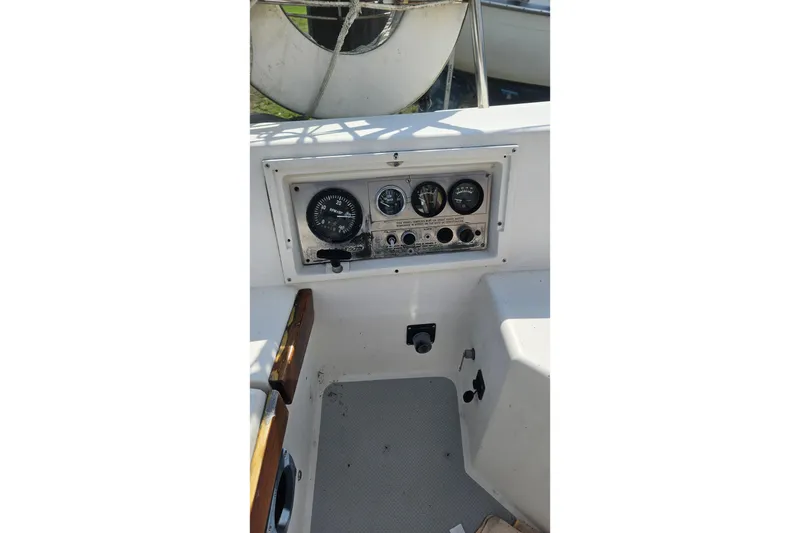 Slide: The Image of Control panel of a 1988 Catalina 34 sailboat with gauges and switches. - 10