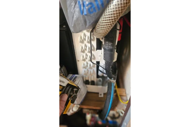 Slide: The Image of Electrical wiring and components inside a 1988 Catalina 34 boat. - 26