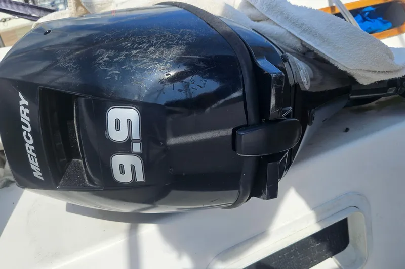 Slide: The Image of Mercury 9.9 outboard motor on 1988 Catalina 34 sailboat deck. - 32