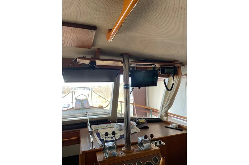 Slide: The Image of 1978 Grand Banks GB36570 boat interior with navigation equipment and controls. - 15