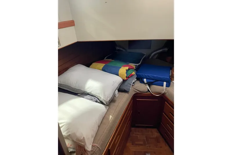 Slide: The Image of Cozy cabin interior of 1978 Grand Banks GB36570 with pillows and colorful bedding. - 16