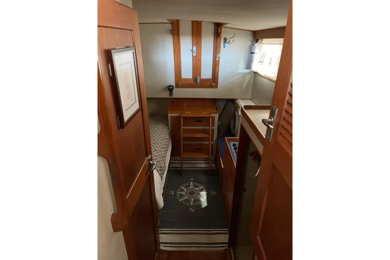 Slide: The Image of 1978 Grand Banks GB36570 cabin interior with wooden furnishings and nautical decor. - 17