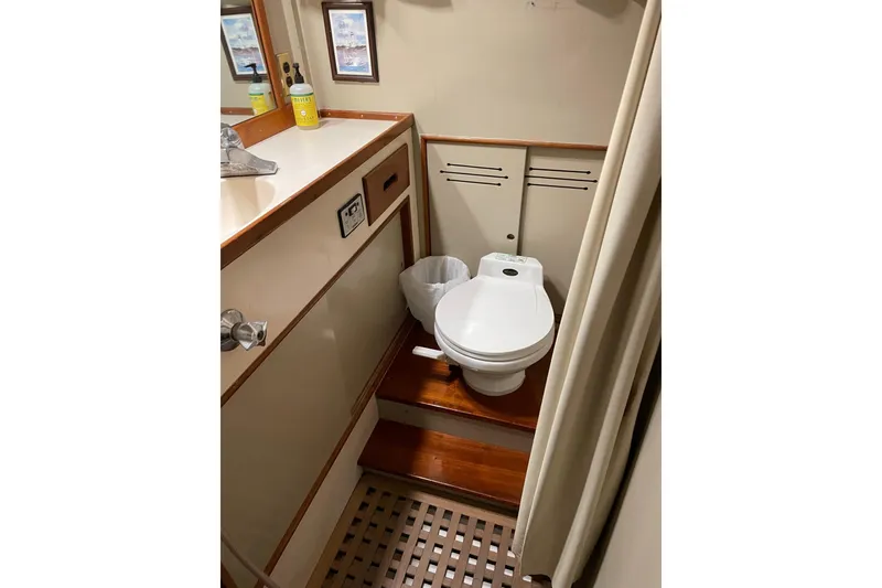 Slide: The Image of 1978 Grand Banks GB36570 yacht bathroom with wooden flooring and compact design. - 18