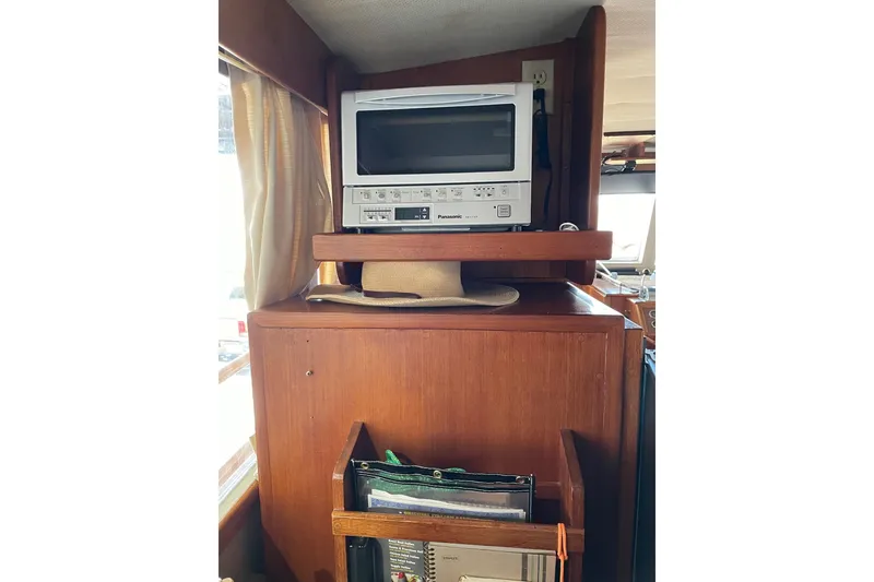 Slide: The Image of 1978 Grand Banks GB36570 interior with vintage TV and wooden cabinetry. - 20