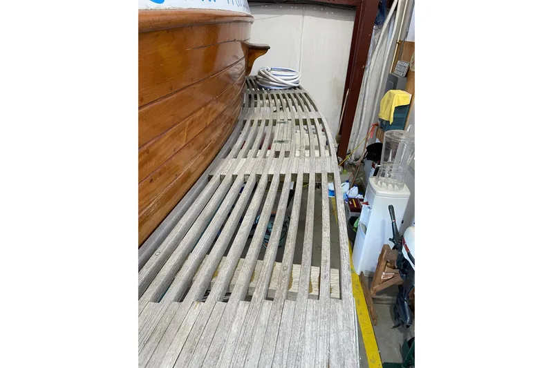 Slide: The Image of 1978 Grand Banks GB36570 boat deck with wooden slats in a storage area. - 3