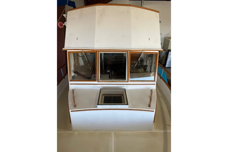 Slide: The Image of 1978 Grand Banks GB36570 boat cabin with wooden trim and windows, viewed from above. - 9