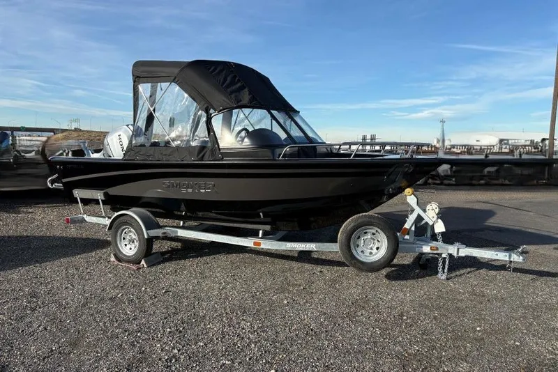 The Image of 2026 Smoker Craft Osprey 162 boat on trailer, black canopy, parked outdoors. - 0