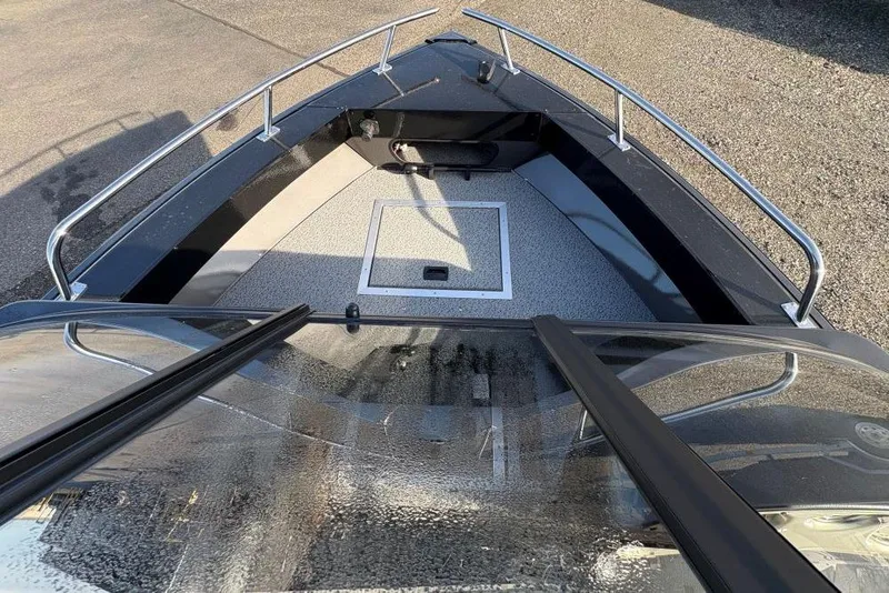 Slide: The Image of 2026 Smoker Craft Osprey 162 boat deck with railing and storage hatch. - 4