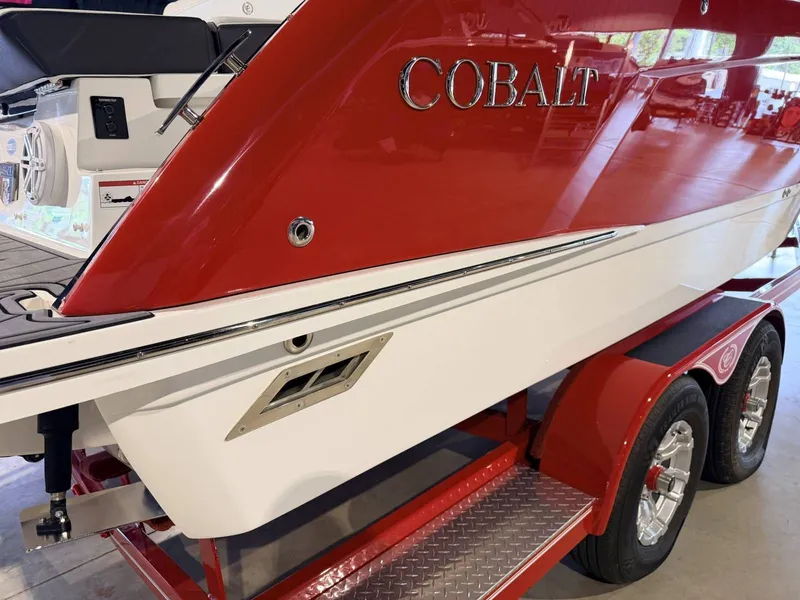 Slide: The Image of Red and white 2025 Cobalt R6 boat on trailer. - 26