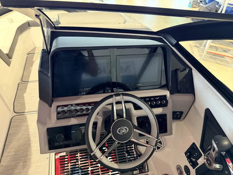 Slide: The Image of Interior view of 2025 Cobalt R6 boat cockpit with modern controls. - 34