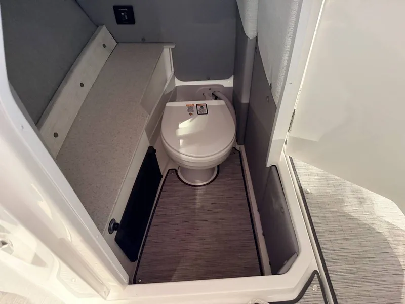 Slide: The Image of Interior of 2025 Cobalt R6 featuring toilet and storage area. - 36