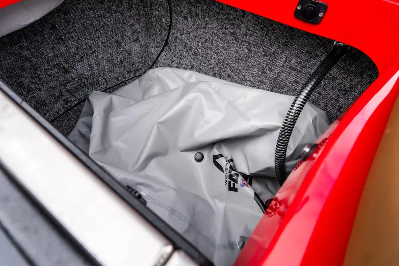 Slide: The Image of 2026 MB B52 23 Classic boat interior with tan leather seats and open storage compartments. - 11