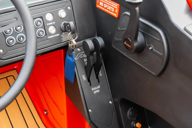 Slide: The Image of Steering wheel and dashboard of 2026 MB B52 23 Classic boat, featuring modern controls. - 15