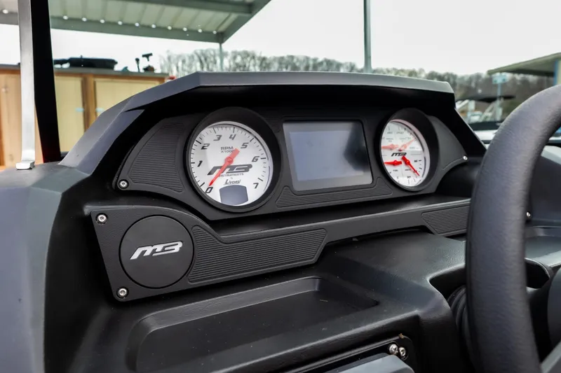 Slide: The Image of Control panel of 2026 MB B52 23 Classic boat with switches and key. - 16