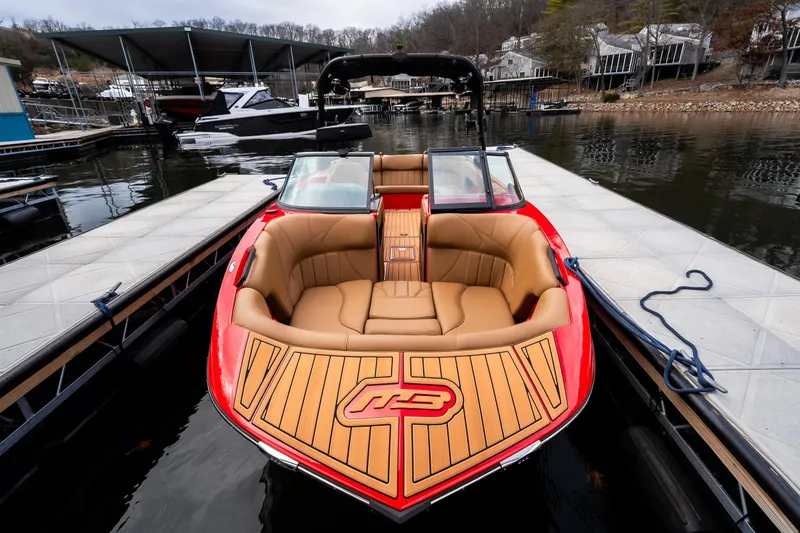 Slide: The Image of Teak deck of 2026 MB B52 23 Classic boat with red logo. - 24