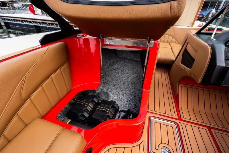 Slide: The Image of 2026 MB B52 23 Classic boat interior with tan seating and red accents. - 28