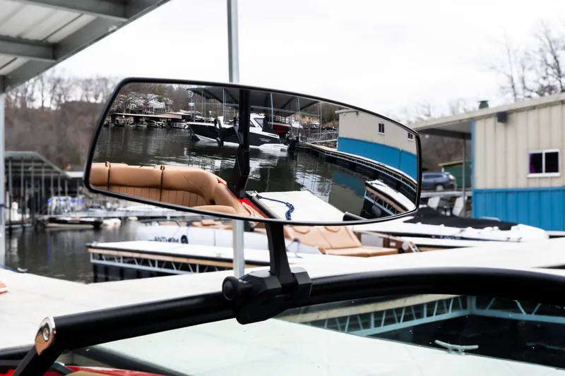 Slide: The Image of Boat accessory on MB B52 23 Classic, 2026 model, docked by the water. - 32