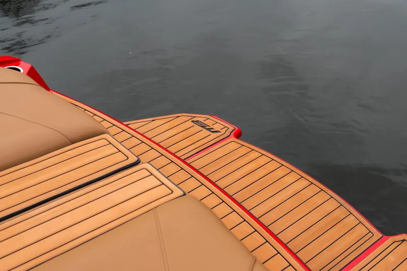 Slide: The Image of 2026 MB B52 23 Classic boat with tan seating and black wakeboard rack. - 34