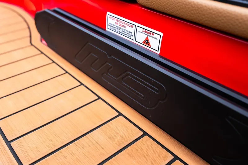 Slide: The Image of 2026 MB B52 23 Classic boat with luxurious tan seating at a marina. - 4