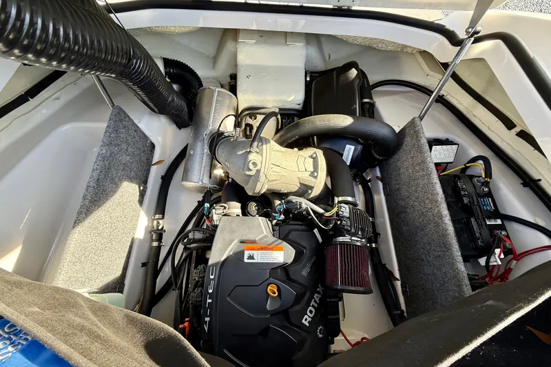 Slide: The Image of Engine compartment of a 2017 Scarab 165 G boat, featuring a Rotax 4-TEC engine. - 17