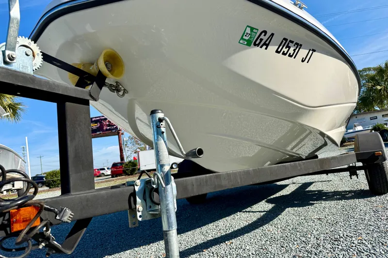 Slide: The Image of 2017 Scarab 165 G boat on trailer, parked outdoors on gravel. - 9