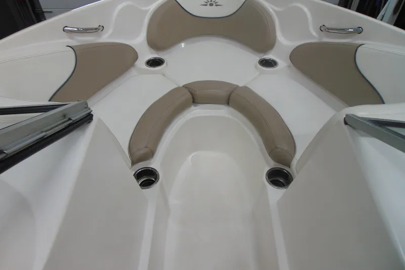 Slide: The Image of Bow seating area of a 2011 Mariah R18.9 boat with beige cushions. - 13