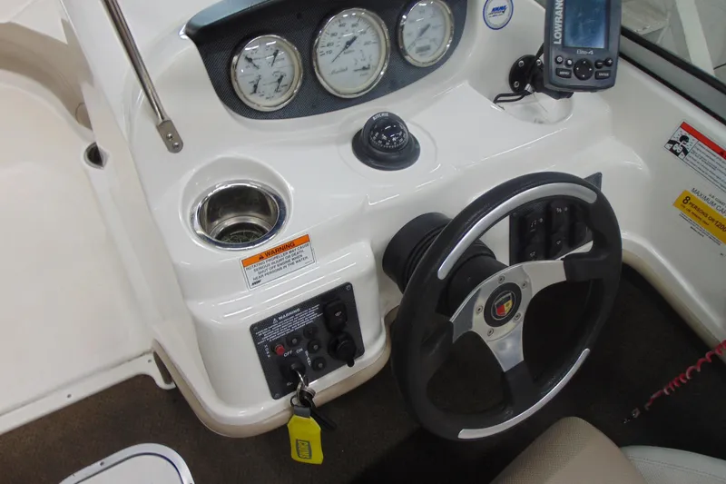 Slide: The Image of Steering console of 2011 Mariah R18.9 boat with gauges and controls. - 14