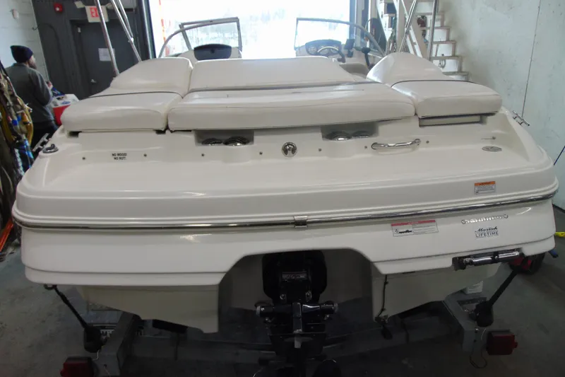 Slide: The Image of Rear view of a 2011 Mariah R18.9 boat in a garage setting. - 3
