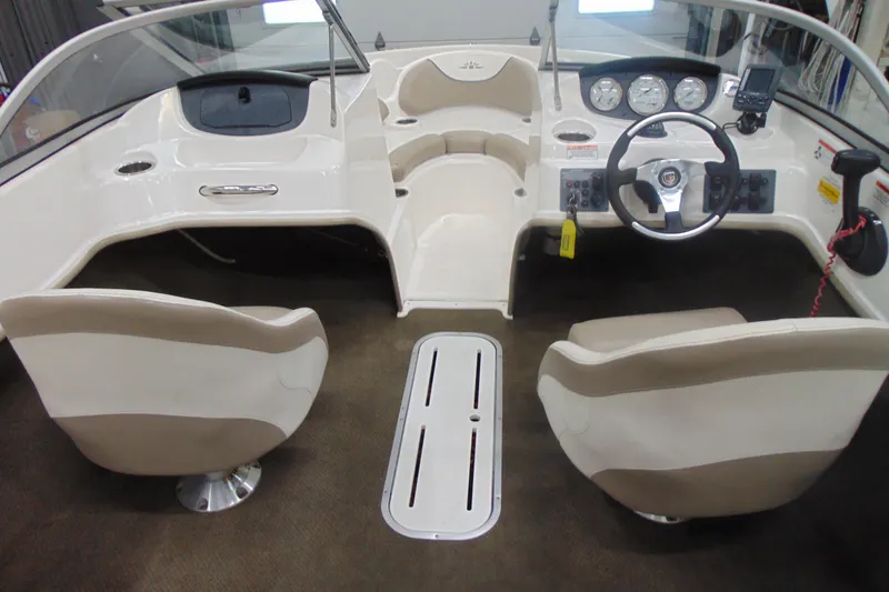 Slide: The Image of Interior of a 2011 Mariah R18.9 boat, featuring steering wheel and dashboard controls. - 9