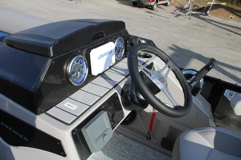 Slide: The Image of Steering console of 2026 Premier 210 Sunsation RE XSD boat with Lowrance display. - 4