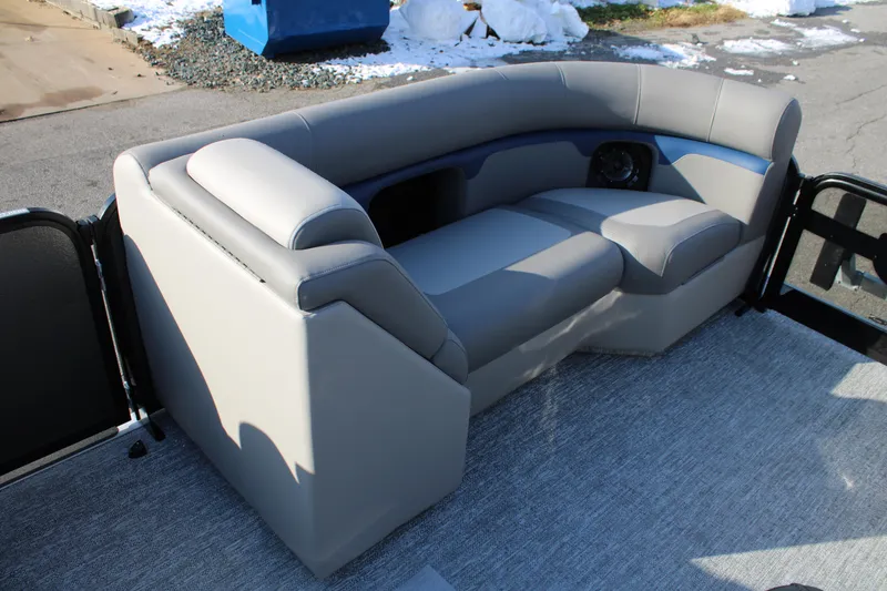 Slide: The Image of 2026 Premier 210 Sunsation RE XSD boat interior with gray seating and carpet flooring. - 8