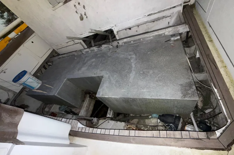 Slide: The Image of Engine compartment of a 1995 Bertram 46 Moppie boat, showing machinery and equipment. - 33