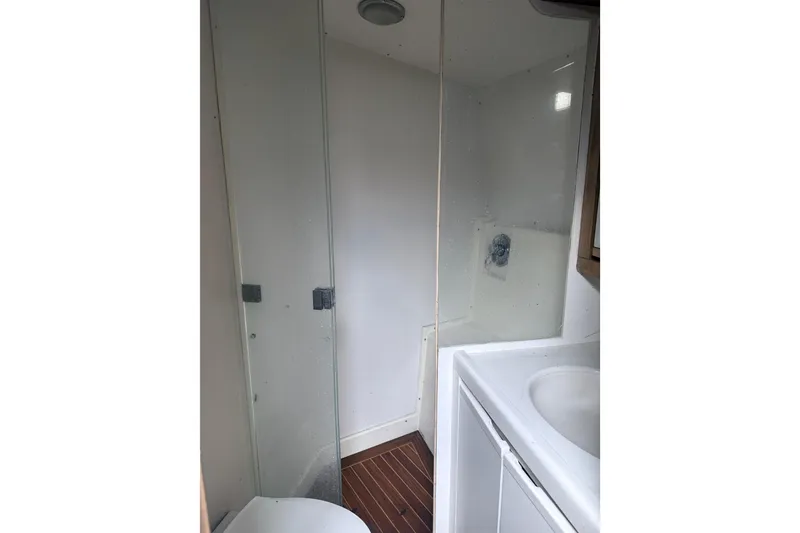 Slide: The Image of Bathroom interior of 1995 Bertram 46 Moppie yacht with shower and sink. - 7