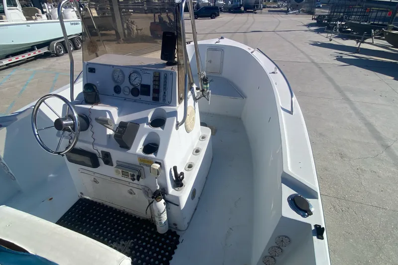 Slide: The Image of 1999 Pro Sports 1850 CC boat interior with steering console and gauges. - 13