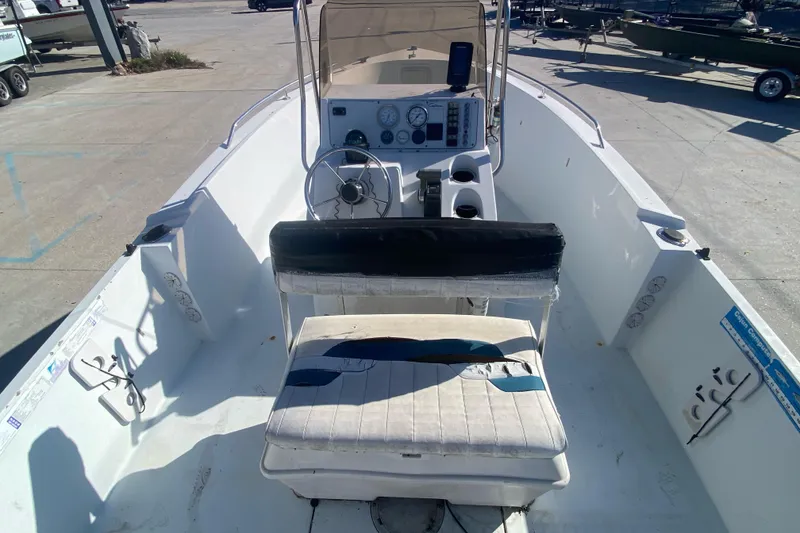 Slide: The Image of 1999 Pro Sports 1850 CC boat interior with steering console and seating. - 16