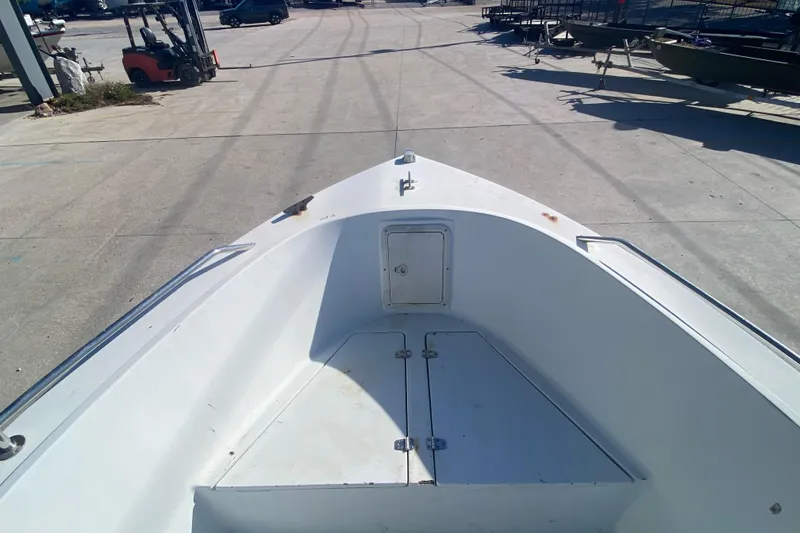 Slide: The Image of 1999 Pro Sports 1850 CC boat bow view at a marina. - 8