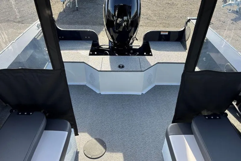 Slide: The Image of 2026 Smoker Craft Osprey 172 boat interior with motor and seating. - 6