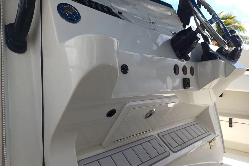 Slide: The Image of 2017 Hydra-Sports 4200 Siesta boat dashboard with steering wheel and controls. - 11