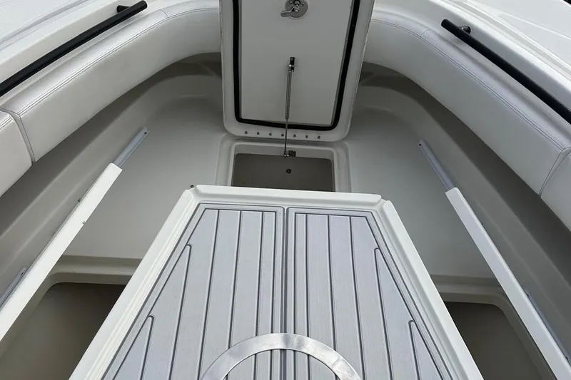 Slide: The Image of 2017 Hydra-Sports 4200 Siesta boat interior with seating and storage compartment. - 15