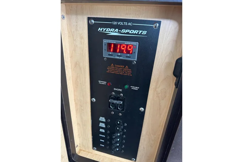 Slide: The Image of Control panel of 2017 Hydra-Sports 4200 Siesta boat, displaying voltage and warning indicators. - 16