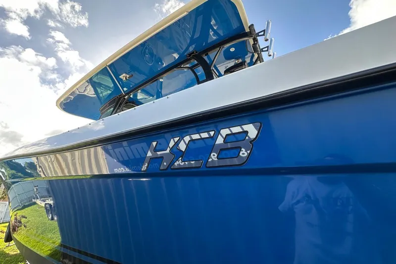 Slide: The Image of 2017 Hydra-Sports 4200 Siesta boat with HCB logo, blue hull, and clear sky background. - 23