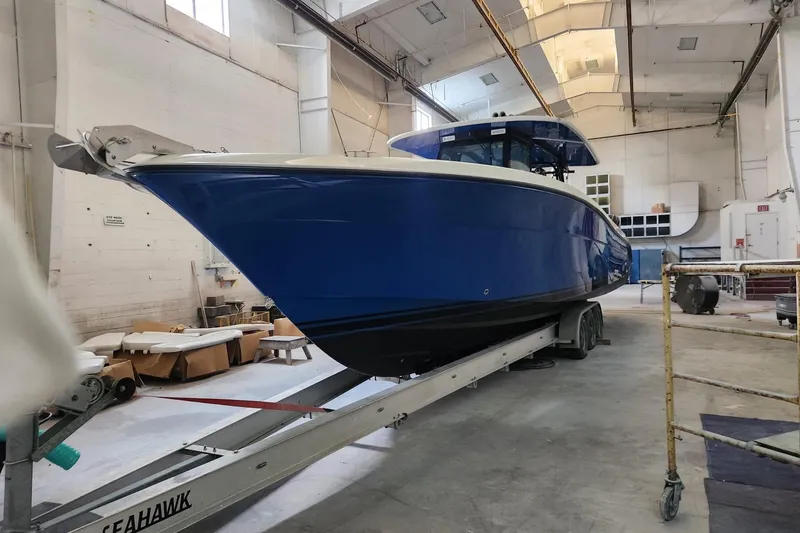 Slide: The Image of 2017 HCB 42 Siesta boat in a workshop on a trailer. - 29